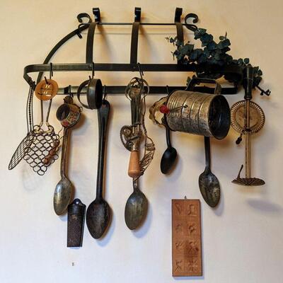 Primitive kitchen tools with wall rack Spoons whisks sifter etc
