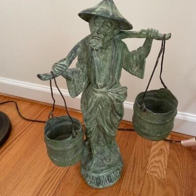 Weathered bronze Asian water carrier