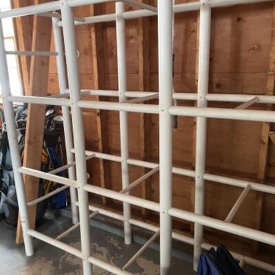 White storage unit with like new blue storage bins that fit into the cubby holes