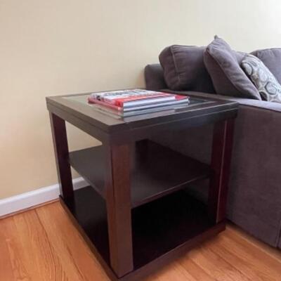 Two glass and wood side tables 