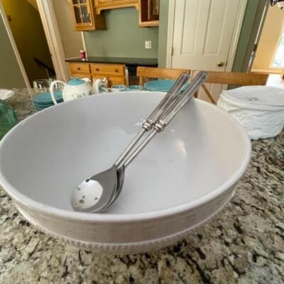 Large white bowl with pedestal and serving spoons