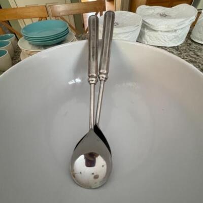Large white bowl with pedestal and serving spoons