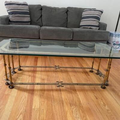 Glass coffee table on brass frame
