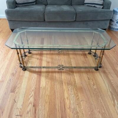 Glass coffee table on brass frame