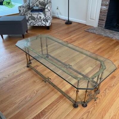 Glass coffee table on brass frame