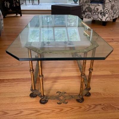 Glass coffee table on brass frame