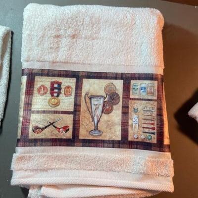 Lot 83 - Golf themed towel set