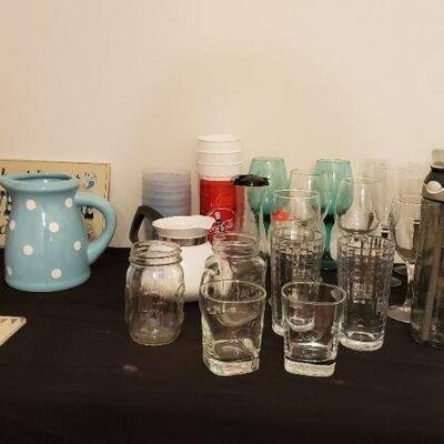 Lot 1: Glassware, Corningware tea kettle with no lid, shark travel mugs, Tools of the Trade knife set, and more.