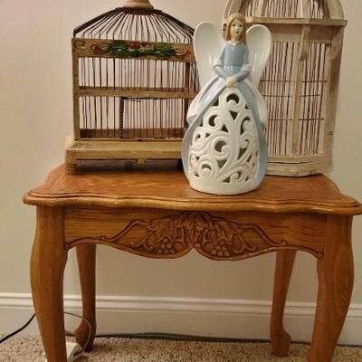 Lot 4:  Wooden side table, two wooden birdcages, one can hang on wall, and a  light up angel.