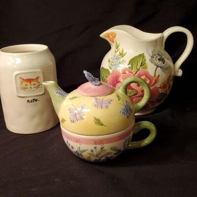 Lot 41: Ceramic tea pots, copper tea kettle, snack set, pitcher, Jack Daniels tin, and more.