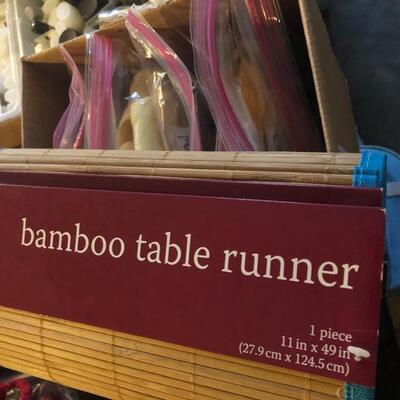 Box of variety of Linens, Tablecloth, and Bamboo Table Runner