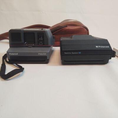 16 - 2 Polaroid Cameras
