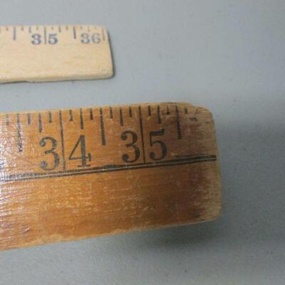 Lot 103 - Advertising Measuring Sticks