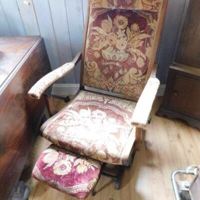 Antique Upholstered Recliner with Sliding Foot Rest