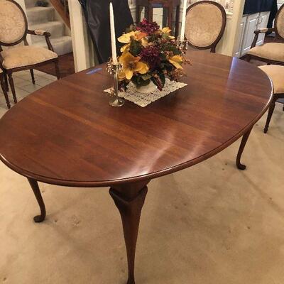 Lot 16 - Ethan Allen Dining Table with 2 Leaves, Custom Pad, Mirror, Decor and Hanging Pictures