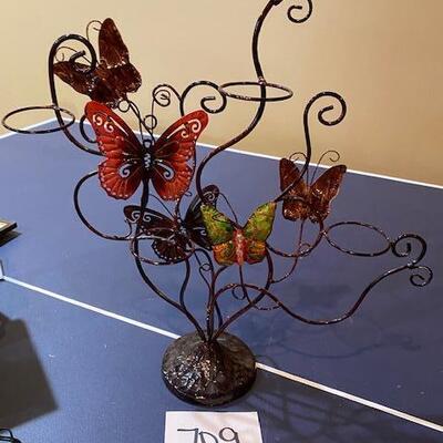 Lot 709 - butterfly candle holder