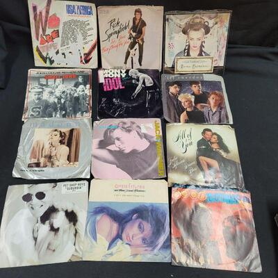 Lot R1: 12 Vinyl 45 rpm with original sleeve most very good pre-owned condition 