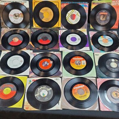 Lot R2: 12 Vinyl 45 rpm with original sleeve most very good pre-owned condition 