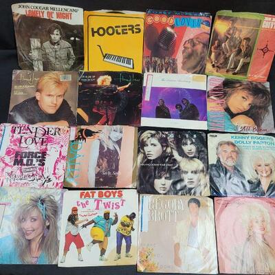 Lot R2: 12 Vinyl 45 rpm with original sleeve most very good pre-owned condition 