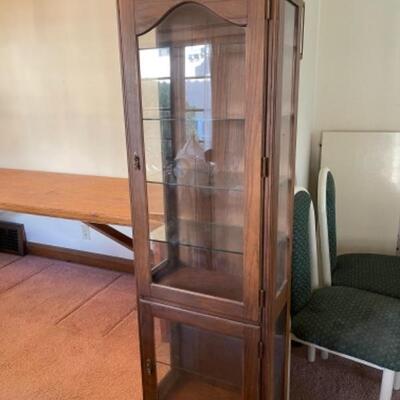 Lot 4. Display cabinet with four glass shelves, walnut color, 64â€x20â€x11â€--$55