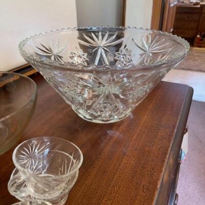 Lot 15. Anchor Hocking glass-footed punch bowl with 12 cups, pitcher and bowl--$45 
