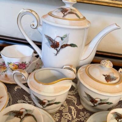 Lot 17. Assortment of English cups and saucers, along with demitasse set (Japan)--$45