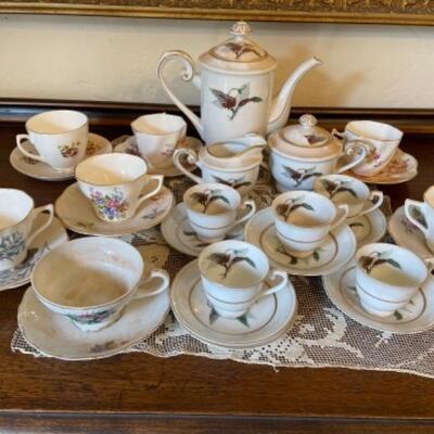 Lot 17. Assortment of English cups and saucers, along with demitasse set (Japan)--$45
