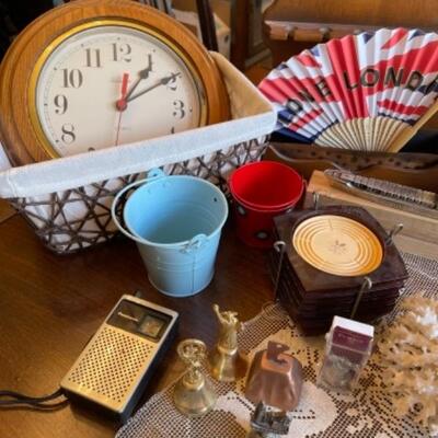 Lot 20. Bells, coasters, souvenirs, music boxes, vintage shelf, clock, Panasonic transistor radio,  family photo album, brass--$35