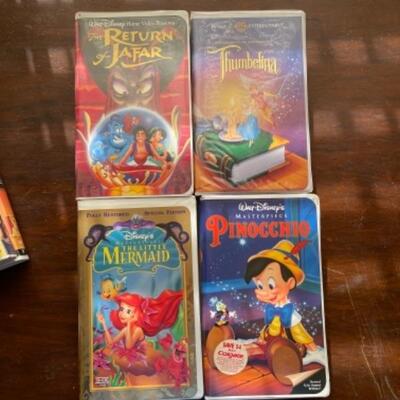 Lot 22. Lot of six Disney VHS tapesâ€”Pinocchio, The Return of Jafar, Little Mermaid, Thumbalina, Lady and The Tramp;, Lion King II...