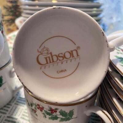 Lot 41. Gibson Christmas dishware, mugs, plates, bowls, trivets, etc.---$40