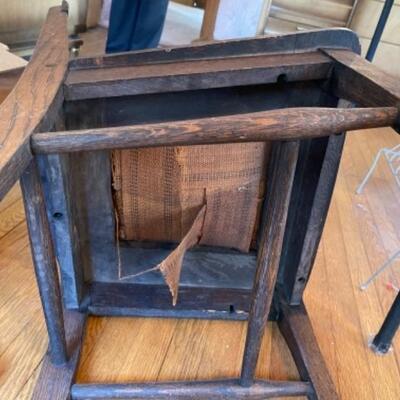 Lot 57. Oak chair with leather seat and claw feet (1920s)--$25