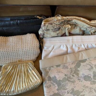 Lot 59. Nineteen purses (wallets, clutches, handbags, shoulder bags;4 pairs of gloves (leathern, knit)--$15