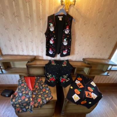 Lot 62. Four holiday vestsâ€”2 Halloween and 2 Christmas--$30