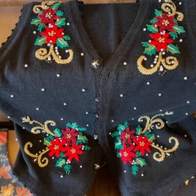 Lot 62. Four holiday vestsâ€”2 Halloween and 2 Christmas--$30