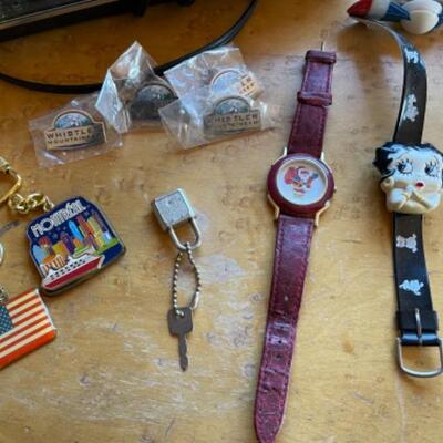 Lot 73. Ten watches, two alarm clocks, 1 phone, keychains, two purse holders and one Bulova watch/1960s with case--$65