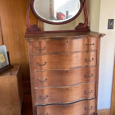 Lot 90. Vintage bow-front highboy, walnut, on wooden casters, 5 drawers, married to a swivel mahogany mirror, all original--$95