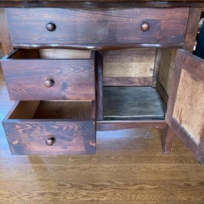 Lot 91. 1920s vintage commodeâ€”three drawers newly repaired and one cupboard--$30 