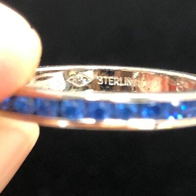 Lot 23 - Sterling Silver Eternity Ring with Blue Stones