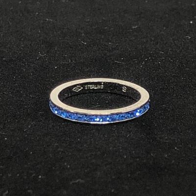 Lot 23 - Sterling Silver Eternity Ring with Blue Stones