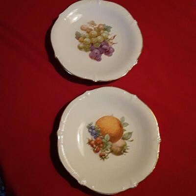 Three serving dishes depicting fruit