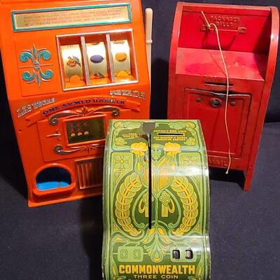 Lot 107: Antique Banks and Toy Slots