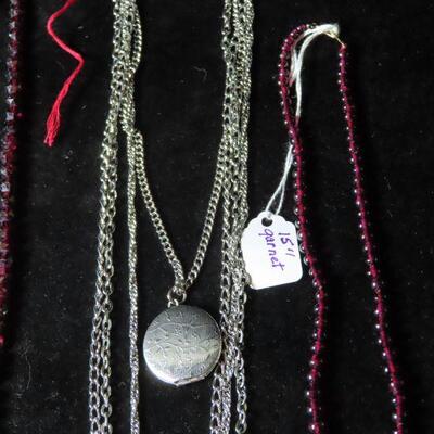 Locket and garnet necklace and beads