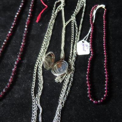 Locket and garnet necklace and beads