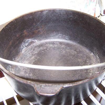 LOT  114  TWO CAST IRON SKILLETS & DUTCH OVEN