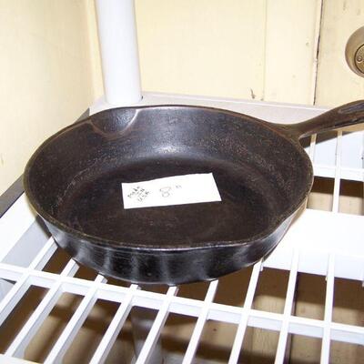 LOT  114  TWO CAST IRON SKILLETS & DUTCH OVEN