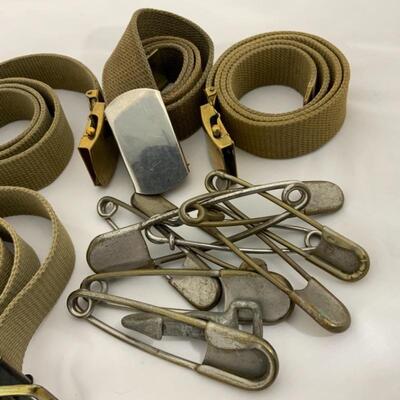 .291. Five Military-Issue Belts | Nine Military-Issue Safety Pins