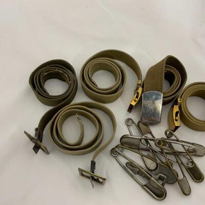 .291. Five Military-Issue Belts | Nine Military-Issue Safety Pins