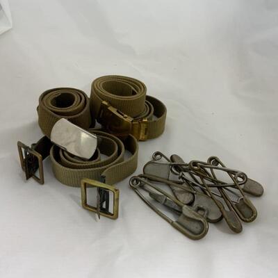 .291. Five Military-Issue Belts | Nine Military-Issue Safety Pins