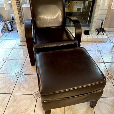 LOT 28  CONTEMPORARY BLACK LEATHER CHAIR & OTTOMAN