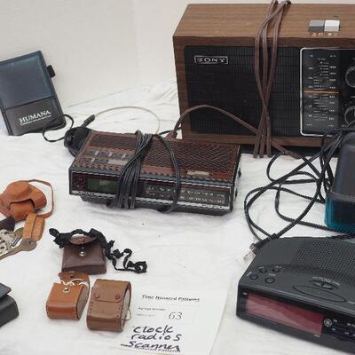 Lot 63 Clock radios, HP Scanner flatbed, various leather vintage holders